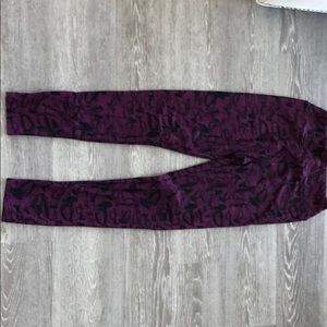 Purple and black leggings with musical instruments